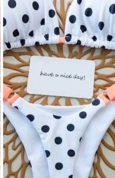 Maillot blanc à pois noirs